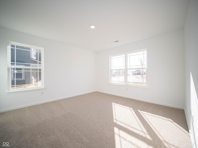 carpeted empty room with recessed lighting and baseboards