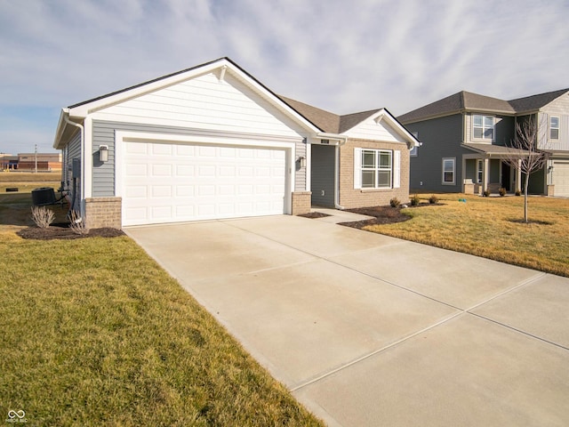 view of front facade with a garage, driveway, brick siding, and a front yard