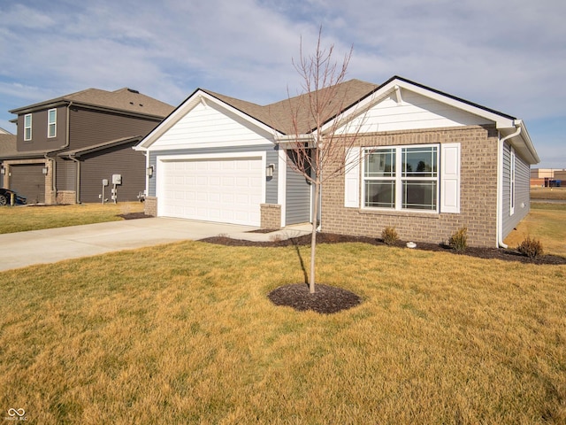 view of front of home featuring a front lawn, brick siding, driveway, and an attached garage