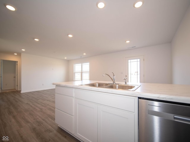 kitchen featuring recessed lighting, a sink, white cabinetry, stainless steel dishwasher, and dark wood finished floors