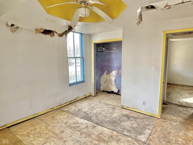 unfurnished bedroom featuring a closet and ceiling fan