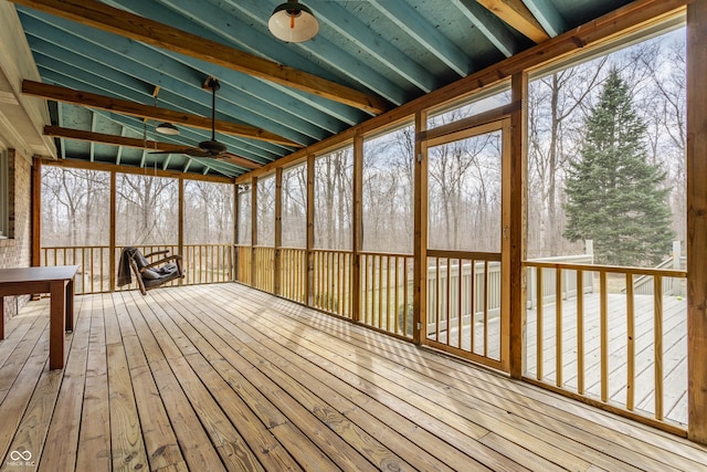 unfurnished sunroom with lofted ceiling