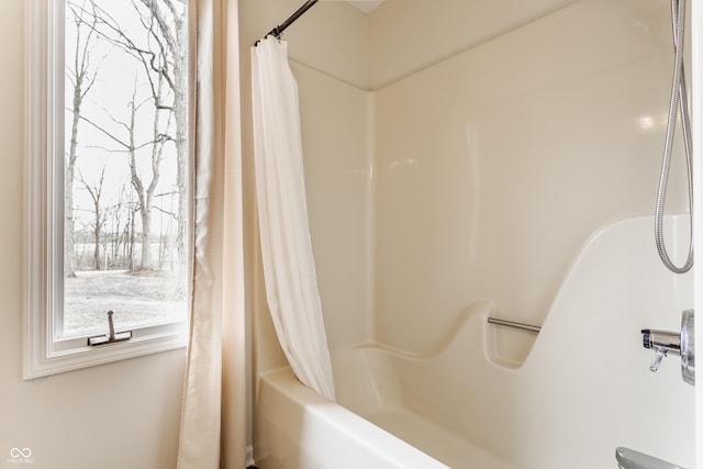 full bath featuring shower / tub combo with curtain