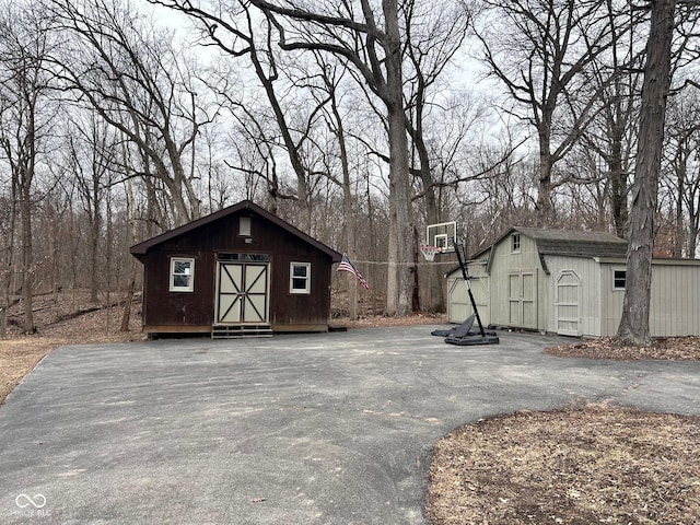 view of shed featuring driveway