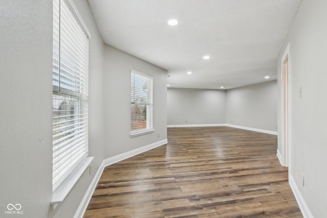 unfurnished room featuring dark hardwood / wood-style flooring