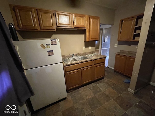 kitchen featuring sink and white fridge