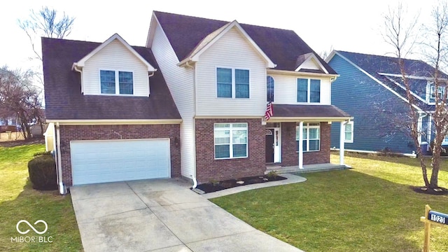 view of front of property with a front yard, concrete driveway, brick siding, and an attached garage