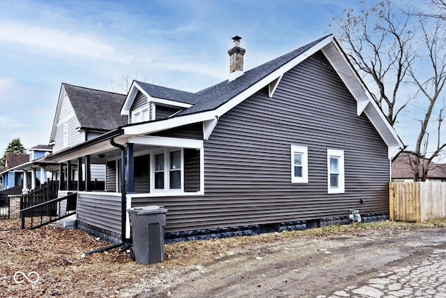 view of property exterior with covered porch