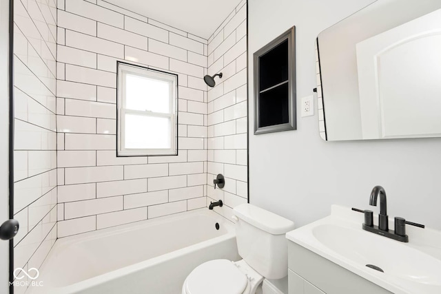 full bathroom with vanity, toilet, and tiled shower / bath combo