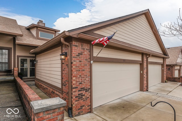 view of side of property featuring a garage