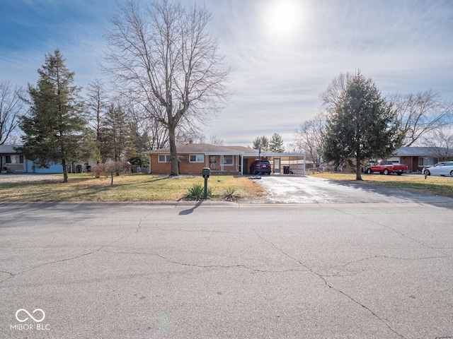 single story home featuring a carport