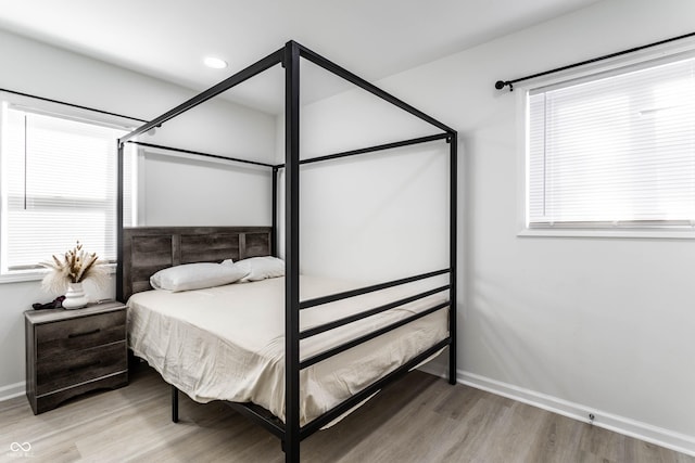 bedroom with hardwood / wood-style flooring