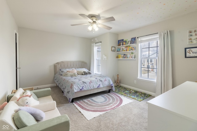 bedroom with carpet, baseboards, and ceiling fan