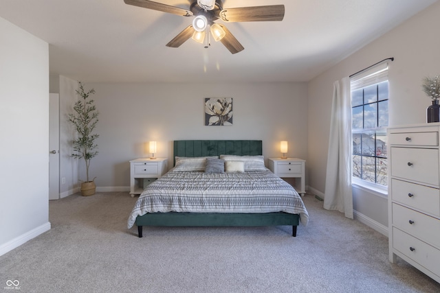 bedroom with baseboards, ceiling fan, and light colored carpet