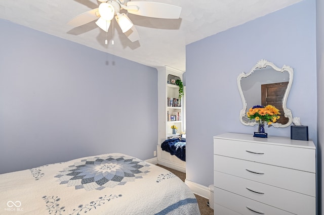 bedroom with baseboards and a ceiling fan