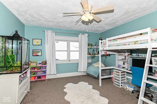 bedroom featuring a textured ceiling, ceiling fan, and carpet floors