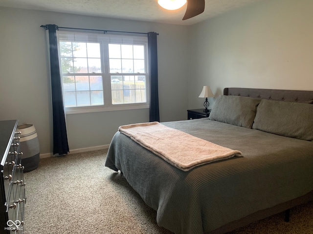 bedroom with ceiling fan and carpet flooring