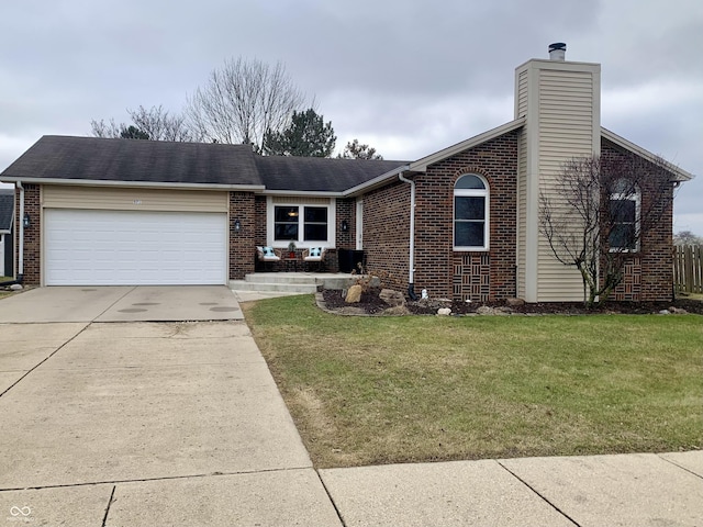 view of front of house featuring a garage and a front yard