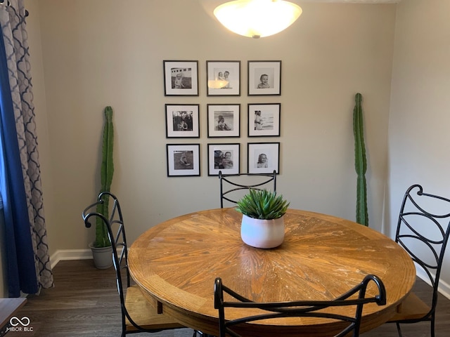 dining room with dark hardwood / wood-style floors