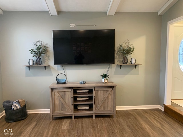 interior space featuring dark hardwood / wood-style floors and beam ceiling