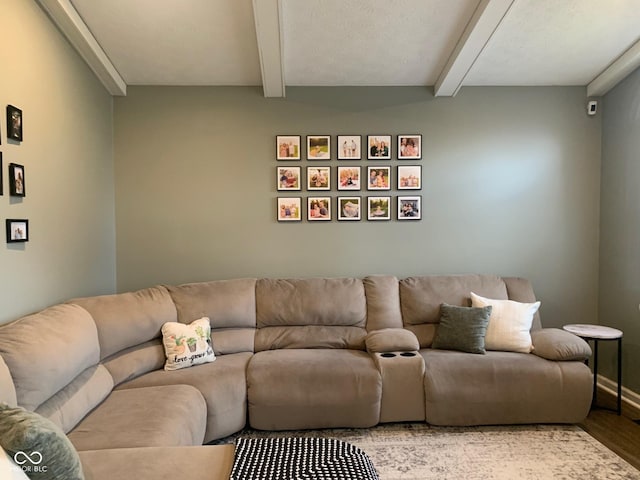 living room with beam ceiling and light hardwood / wood-style floors