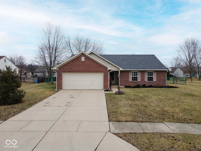 ranch-style house with a garage and a front lawn