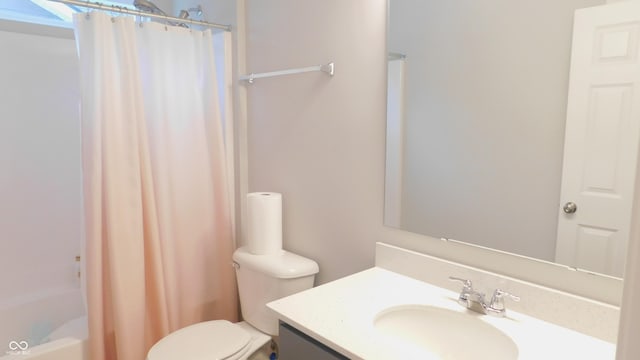 full bathroom featuring vanity, shower / bath combo, and toilet