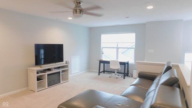 living room featuring ceiling fan and light carpet