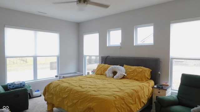 bedroom with ceiling fan and carpet