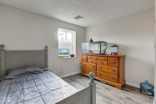 bedroom featuring wood-type flooring