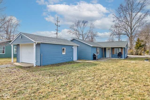 back of house featuring a porch, a garage, and a lawn