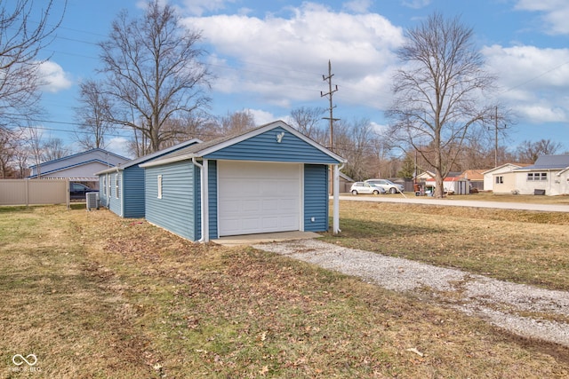 garage featuring a lawn