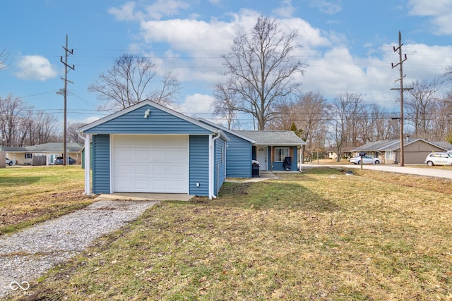 view of front of property featuring a porch, a garage, and a front yard