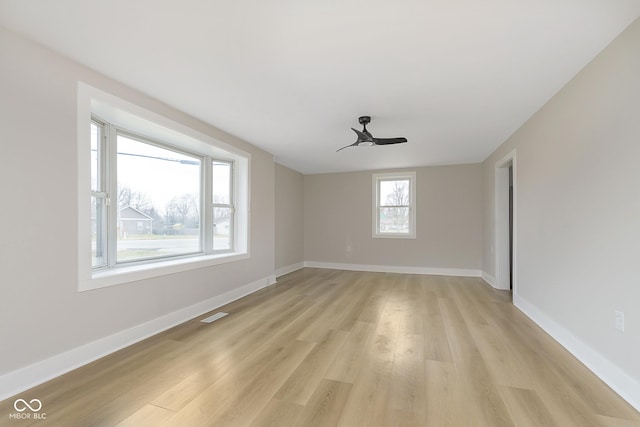 unfurnished room featuring ceiling fan and light hardwood / wood-style flooring