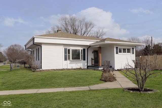 ranch-style home with a front lawn