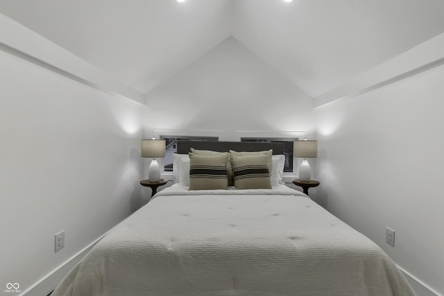 bedroom featuring vaulted ceiling