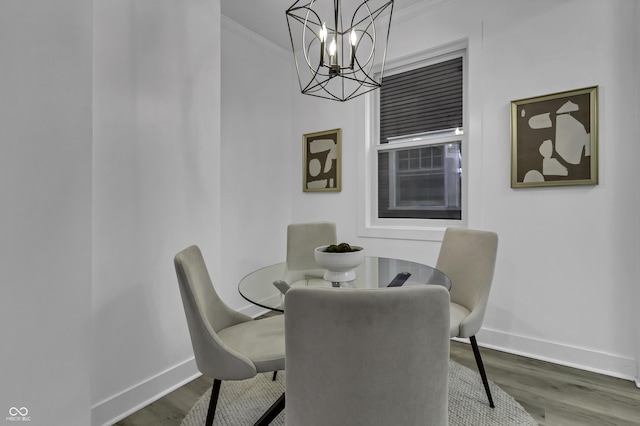 dining area featuring crown molding and hardwood / wood-style floors