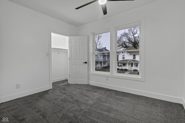 carpeted empty room with ceiling fan