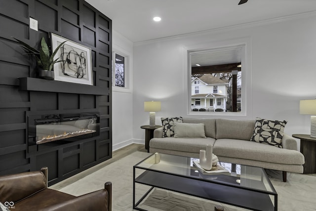 living room with crown molding and light wood-type flooring