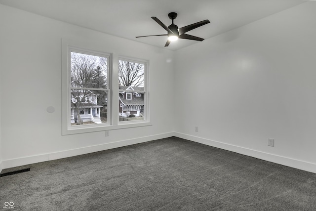 carpeted empty room with ceiling fan