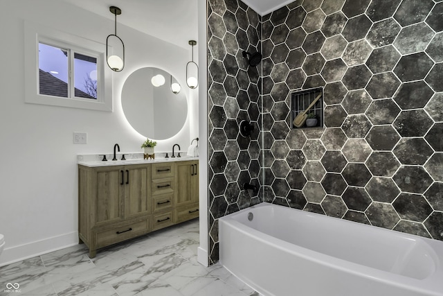 bathroom featuring vanity and a bath