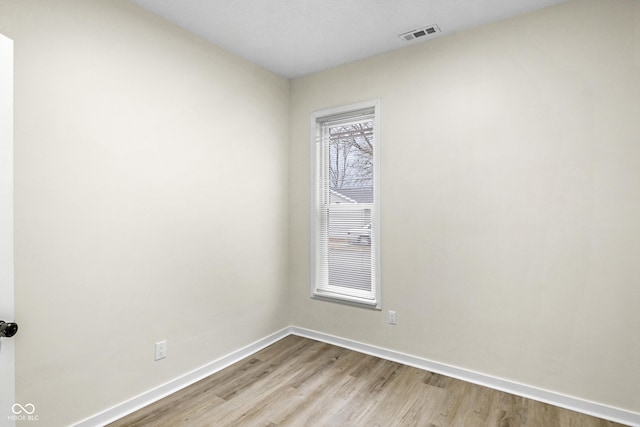 spare room featuring light hardwood / wood-style flooring