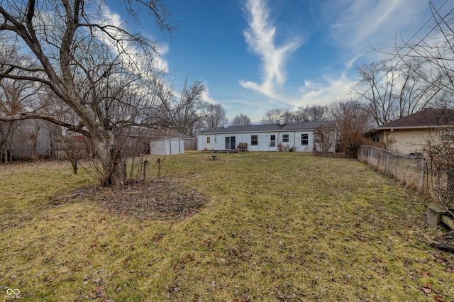 view of yard with a storage unit