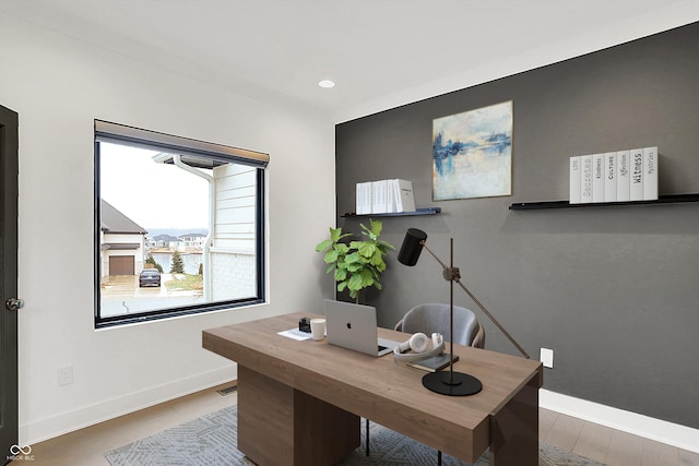 home office with wood-type flooring