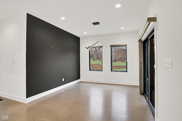 spare room featuring hardwood / wood-style floors