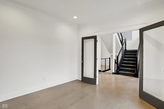 interior space with hardwood / wood-style flooring and french doors