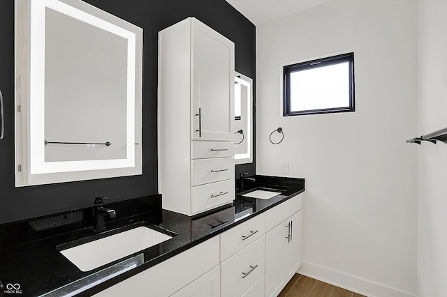 bathroom featuring vanity and hardwood / wood-style floors