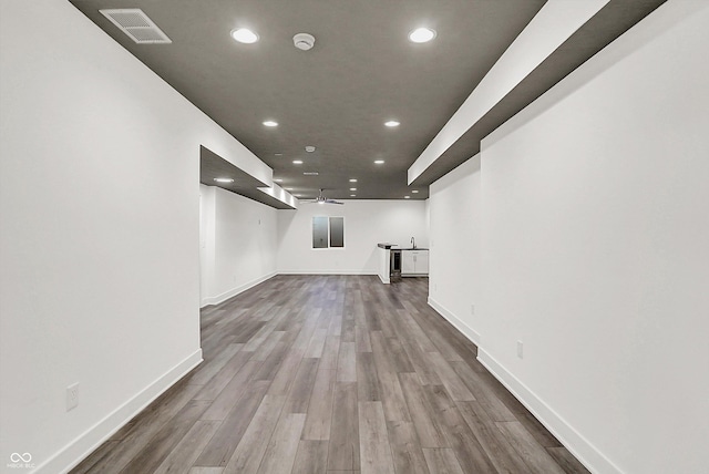 basement featuring hardwood / wood-style flooring