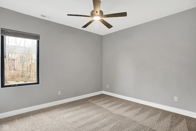 carpeted empty room with ceiling fan