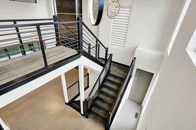 stairs featuring wood-type flooring